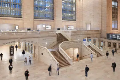 Apple Store inside Grand Central Terminal with people walking around.