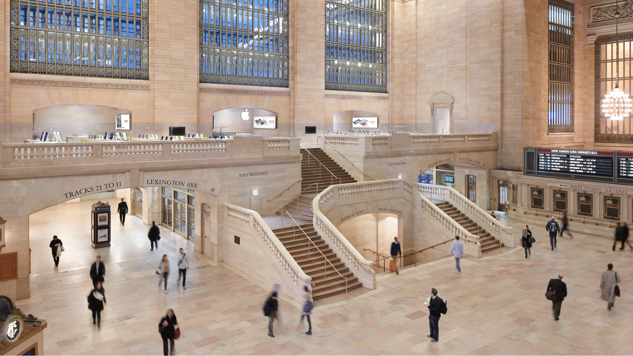 Apple Store inside Grand Central Terminal with people walking around.