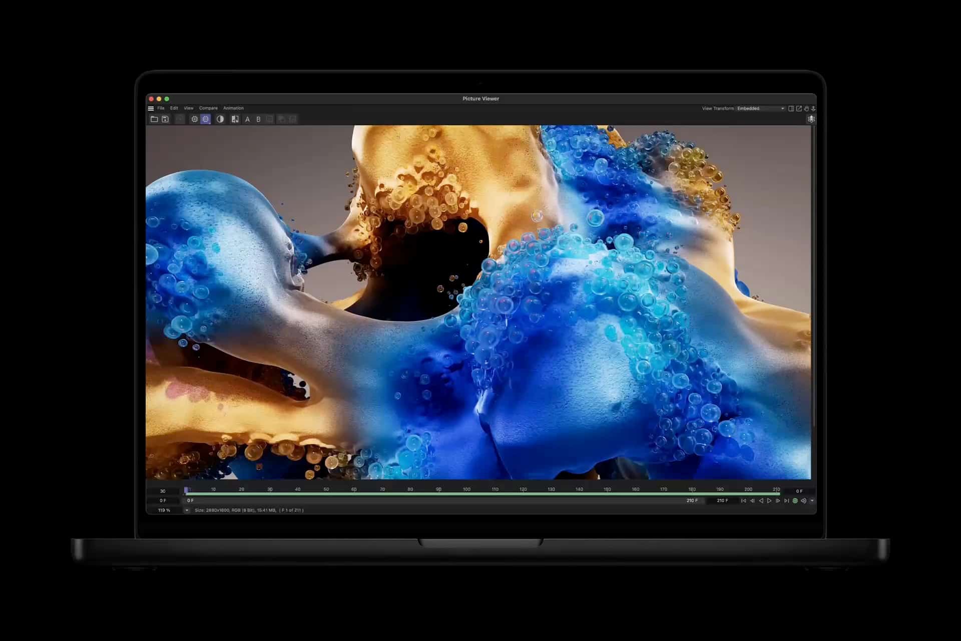 MacBook Pro displaying colourful 3D graphics on screen.