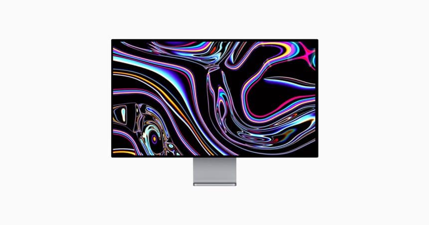 Apple Studio Display showing colourful abstract wallpaper on a slim monitor stand.