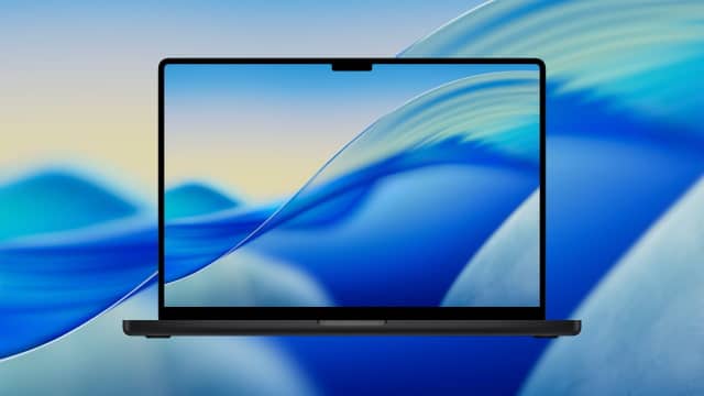 MacBook displaying macOS Tahoe wallpaper on screen.