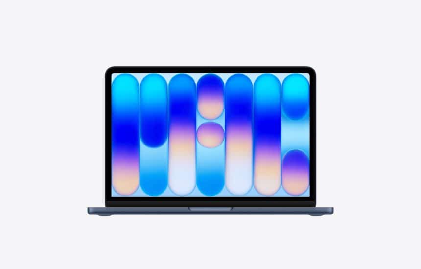 MacBook displaying colourful MacBook Neo wallpaper on its screen.