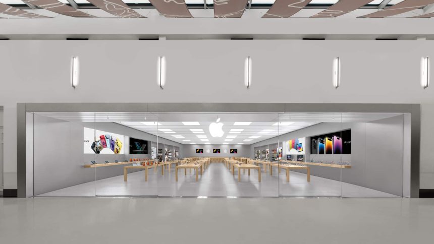 Apple retail store interior with display tables and products.