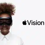 Person wearing Apple Vision Pro headset with logo displayed.