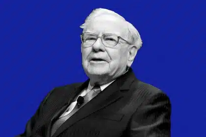 Portrait of Warren Buffett speaking against a blue background