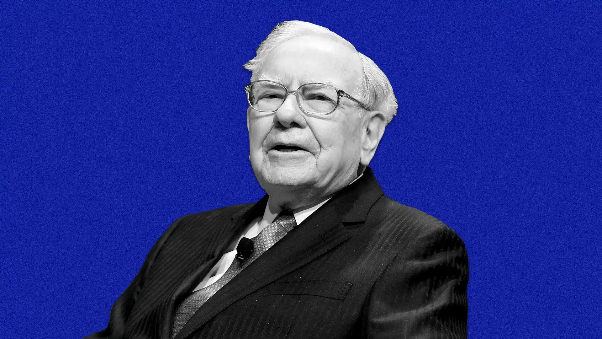 Portrait of Warren Buffett speaking against a blue background