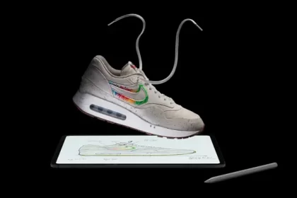 Sneaker floating above a tablet with a stylus.