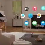 Person wearing a VR headset viewing apps in a living room.