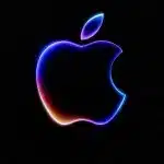 Glowing Apple logo on a dark background.
