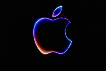 Glowing Apple logo on a dark background.