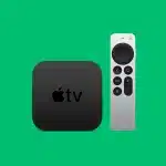 Apple TV box with remote on green background.