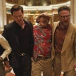 Cast of The Studio walking through a hotel lobby scene.
