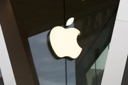 Apple logo on a modern glass building exterior.