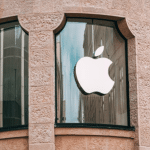 Apple logo displayed on a storefront window.