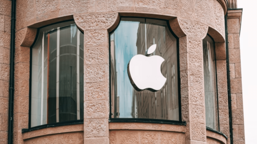Apple logo displayed on a storefront window.