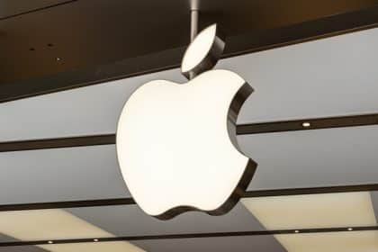 Apple logo hanging inside a modern retail store.