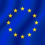 European Union flag with yellow stars on blue background.