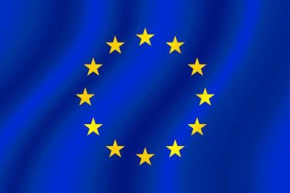 European Union flag with yellow stars on blue background.