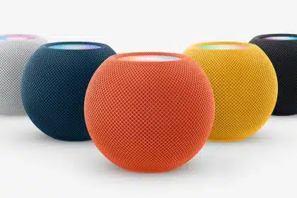 Apple HomePod mini speakers in multiple colours on a plain background.