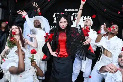 Lady Gaga performing with dancers during Apple Music Live event.
