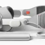 Apple Vision Pro headset with external battery pack and cable.