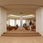 Modern Apple Developer Center auditorium with curved architecture and seating areas.