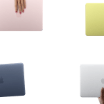 Colourful Apple MacBook Neo laptops displayed in pink, green, blue, and silver finishes.