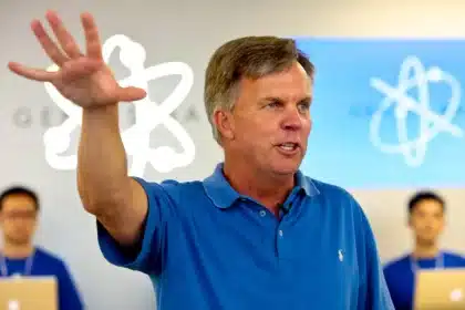 Ron Johnson speaking and gesturing during an event in an Apple Store.