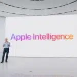 Apple executive presenting Apple Intelligence on a large display during a keynote event.