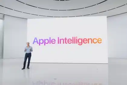 Apple executive presenting Apple Intelligence on a large screen during a keynote event.