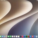 macOS Golden Gate desktop with a modern abstract wallpaper and app dock.