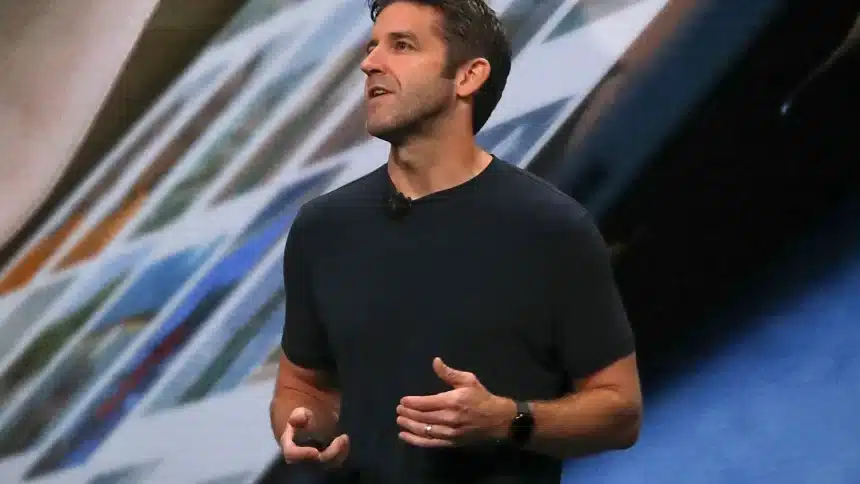 John Ternus speaking during an Apple keynote presentation.