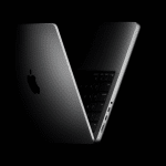 Space Black MacBook Pro partially open against a black background.