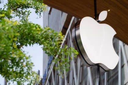 Apple logo displayed outside an Apple Store building.