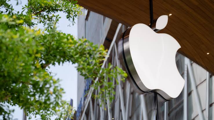 Apple logo displayed outside an Apple Store building.