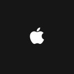 White Apple logo on a black background.