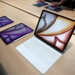 Apple iPads on display with Magic Keyboard and Apple Pencil.