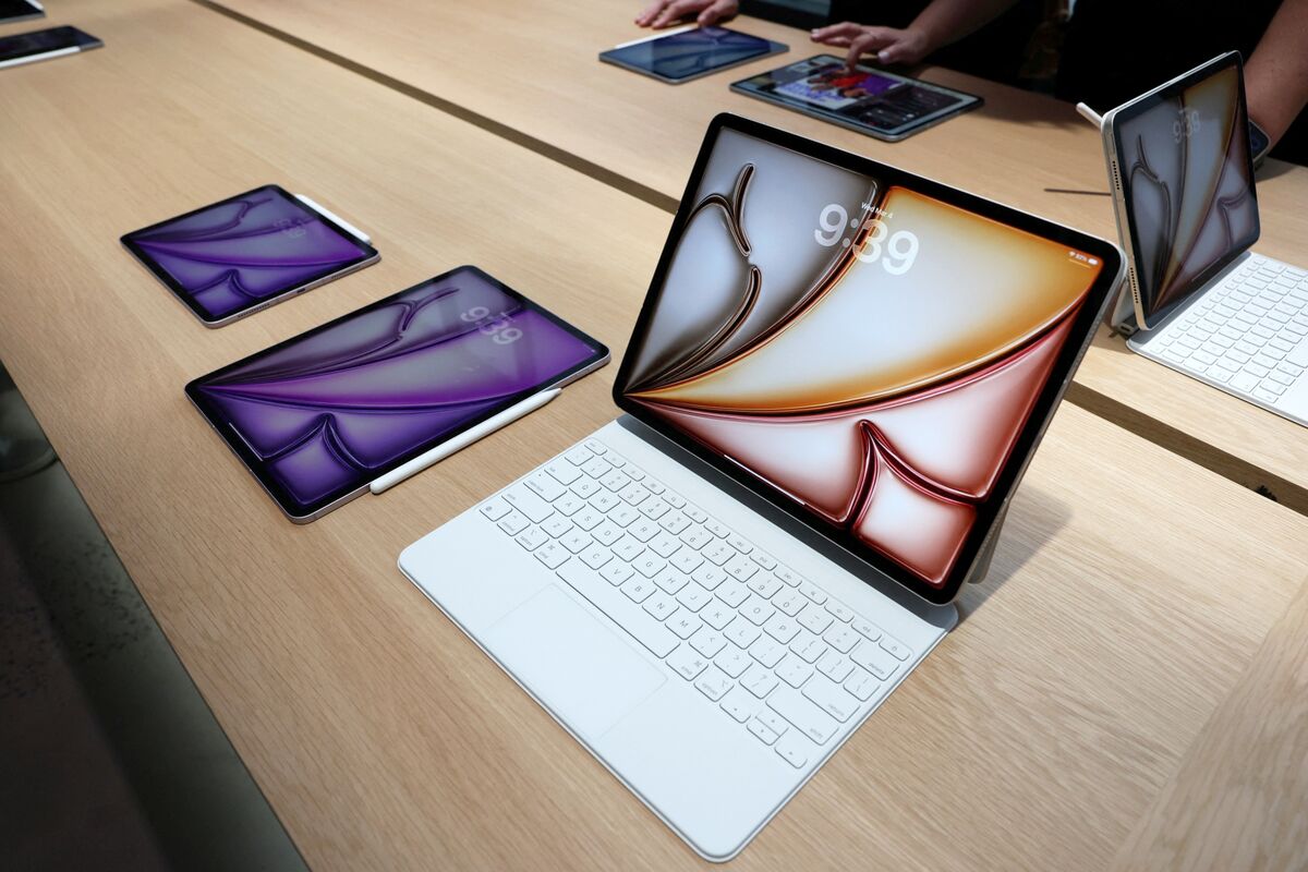 Apple iPads on display with Magic Keyboard and Apple Pencil.