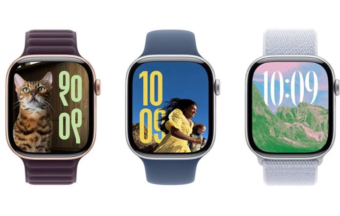 Three Apple Watches displaying different watch faces and colourful bands.