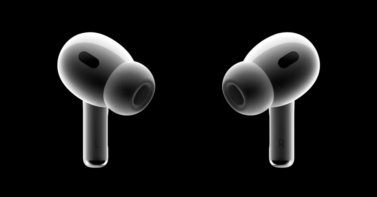 Apple AirPods Pro earbuds on a black background.
