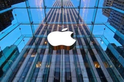 Apple logo displayed on the glass front of an Apple Store.