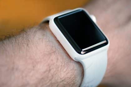 White ceramic Apple Watch on a person's wrist.