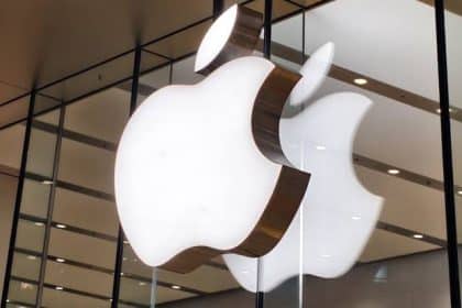 Illuminated Apple logos displayed inside an Apple Store.