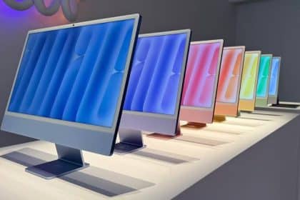 Colourful Apple iMacs displayed in a row.