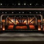 Interior of Apple Music Hall in London, featuring a stage and tiered seating.