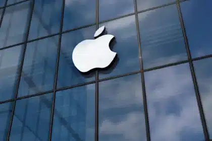Apple logo displayed on a glass building.
