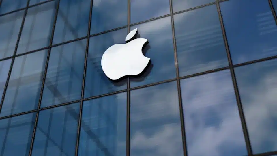 Apple logo displayed on a glass building.