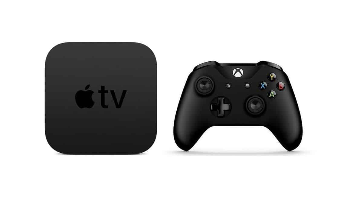 Apple TV device beside a black gaming controller.