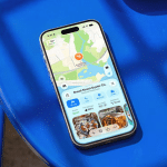 iPhone displaying Apple Maps on a blue chair.