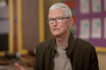 Gray-haired man wearing glasses during an interview.